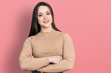 Obraz premium Young hispanic woman wearing casual clothes happy face smiling with crossed arms looking at the camera. positive person.