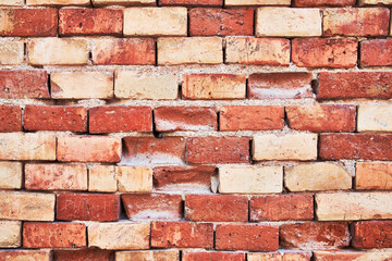 Brick wall texture with cracked tiles and cement. Classic brickwall surface background