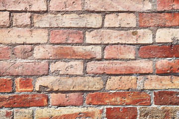 Brick wall texture with cracked tiles and cement. Classic brickwall surface background