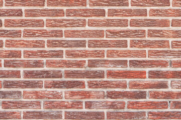 Brick wall texture with cracked tiles and cement. Classic brickwall surface background
