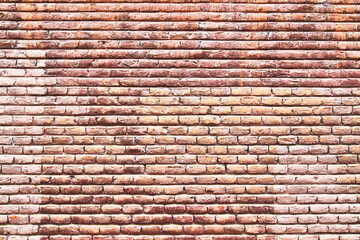 Brick wall texture with cracked tiles and cement. Classic brickwall surface background