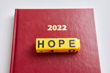 The word hope is composed of letters for the business diary of 2022. Hope for a better life in 2022.