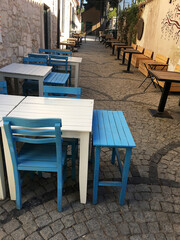 Retro style cafe in the street with cobblestones