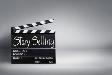 Naklejka premium Story Selling, Handwriting on film slate.Finance and the film industry