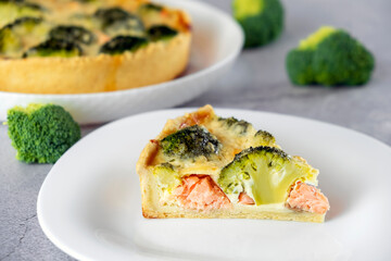 Egg-based frittata, omelette with salmon, broccoli and soft cheese in crust. Mediterranean paleo or ketogenic healthy diet. Delicisouc dish for restaurant or cafe menu.