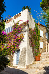 Fototapeta na wymiar View of narrow charming streets in small French township of Grimaud in sunny summer day, Var department.