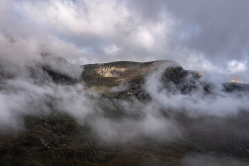Aerial view of flying drone Dramatic epic landscape image in Autumn of Y-Garn in Snowdonia National Park
