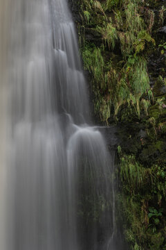 Stunning long exposure landscape early Autumn image of Pistyll Rhaeader waterfall in Wales, the tallest waterfall in UK