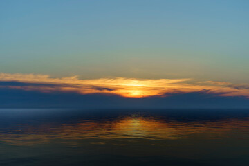 Beautiful background with sunset over the sea