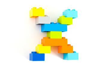 Colorful toy brick letter X