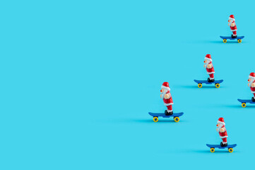Santa Clauses riding skateboards as Christmas and New year concept