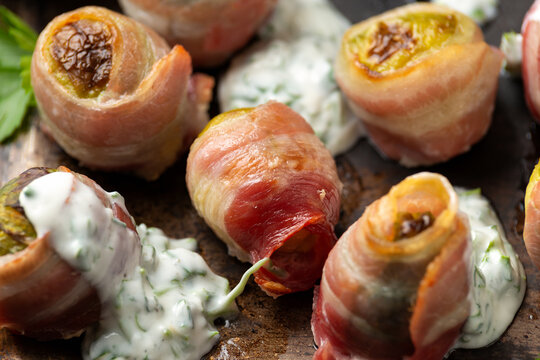 Streaky bacon wrapped Brussel sprouts with yogurt herb sauce. party food.