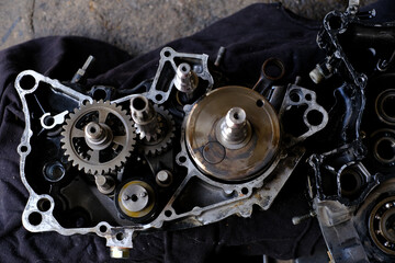 Assemble the motorcycle engine gear by a maintenance technician and check it.