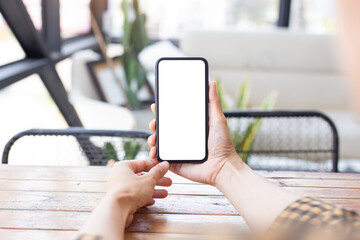 cell phone blank white screen mockup.hand holding texting using mobile on desk at office.background empty space for advertise.work people contact marketing business,technology
