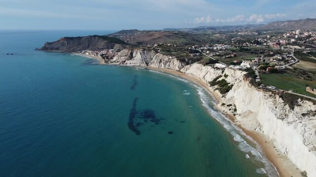 Diagonal Pan of a White Cliff Coast in the Meditteranean Sea