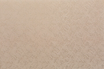 textured abstract embroidery ornament on fabric beige