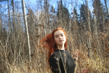 Young woman in the autumn forest girl pretty cute face female smile field red hair beauty one person model portrait girls outdoor beautiful lady