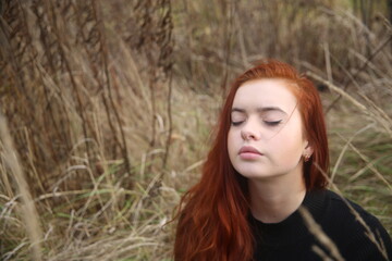 portrait of a young girl with red hair in forest pretty woman cute  face one person portrait beauty smile model field