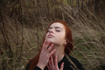 portrait of a young girl with red hair in forest pretty woman cute one person portrait beauty smile