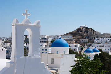 Beautiful Ios Island Greece. Charming old village with view of traditional old churches and...