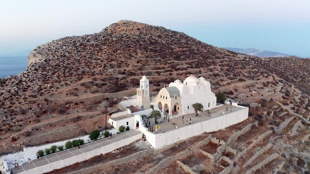 Aerial descending shot famous Panagia Church on hilltop, Folegandros Island
