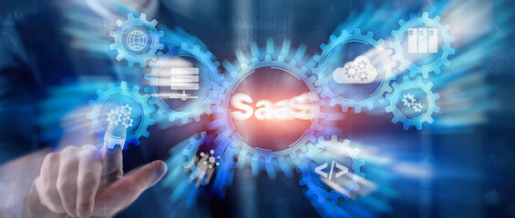 SaaS Software as a Service concept with hand pressing text