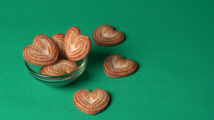 Delicious homemade heart shaped cookie on a color background. Top View. Place for text.