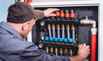HVAC technician servicing home heating and cooling system