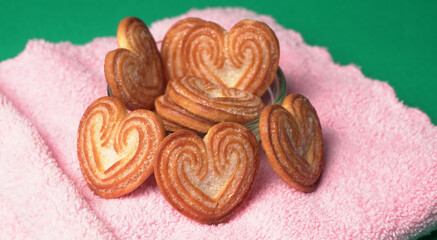 Delicious homemade heart shaped cookie on a color background. Top View. Place for text.