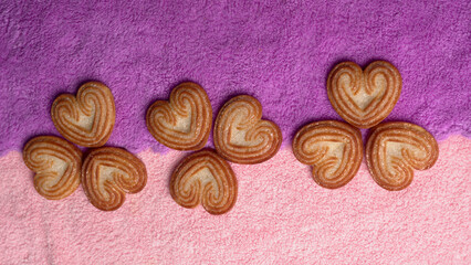 Fototapeta na wymiar Delicious homemade heart shaped cookie on a color background. Top View. Place for text.