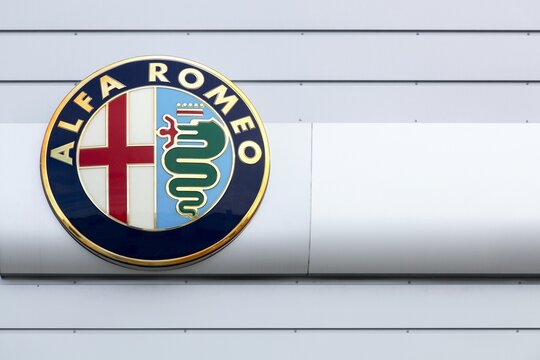 Risskov, Denmark - September 10, 2015: Alfa Romeo logo on a wall. Alfa Romeo is an Italian car manufacturer