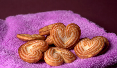 Delicious homemade heart shaped cookie on a color background. Top View. Place for text.
