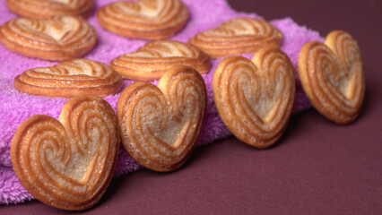 Delicious homemade heart shaped cookie on a color background. Top View. Place for text.
