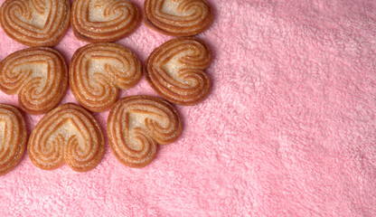 Delicious homemade heart shaped cookie on a color background. Top View. Place for text.
