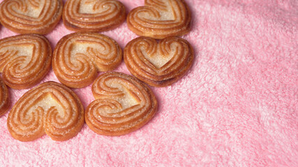 Delicious homemade heart shaped cookie on a color background. Top View. Place for text.
