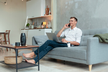 young man is relaxing in a cozy living room.