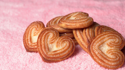 Delicious homemade heart shaped cookie on a color background. Top View. Place for text.

