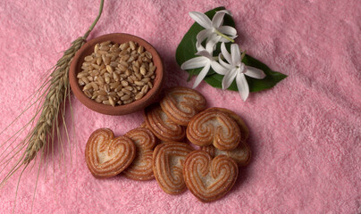 Delicious homemade heart shaped cookie on a color background. Top View. Place for text.
