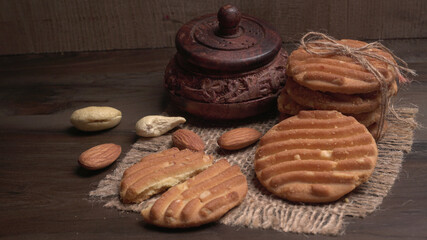 Homemade oatmeal cookies with flax and sesame seeds on white wooden table, copy space. Healthy vegan oat cookies
