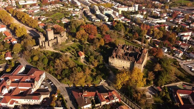 Aerial zoom in guimares Portugal old town medieval castle and palace in the forest