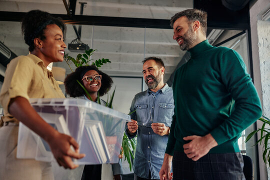 Coworkers greets their female colleague who return to work