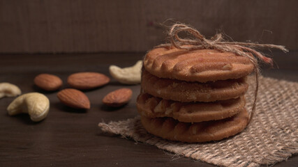 Homemade oatmeal cookies with flax and sesame seeds on white wooden table, copy space. Healthy vegan oat cookies