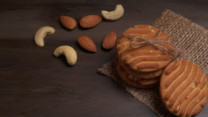 Homemade oatmeal cookies with flax and sesame seeds on white wooden table, copy space. Healthy vegan oat cookies