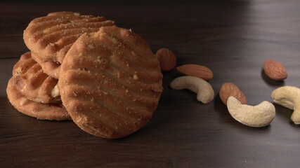 Homemade oatmeal cookies with flax and sesame seeds on white wooden table, copy space. Healthy vegan oat cookies
