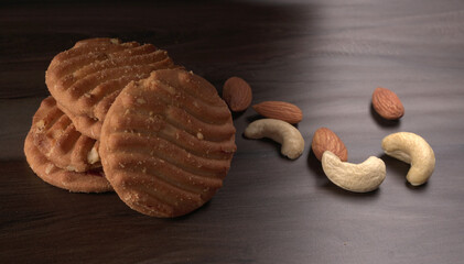 Homemade oatmeal cookies with flax and sesame seeds on white wooden table, copy space. Healthy vegan oat cookies