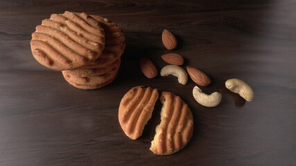 Homemade oatmeal cookies with flax and sesame seeds on white wooden table, copy space. Healthy vegan oat cookies