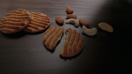 Homemade oatmeal cookies with flax and sesame seeds on white wooden table, copy space. Healthy vegan oat cookies