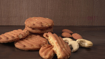 Homemade oatmeal cookies with flax and sesame seeds on white wooden table, copy space. Healthy vegan oat cookies