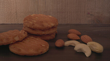 Homemade oatmeal cookies with flax and sesame seeds on white wooden table, copy space. Healthy vegan oat cookies