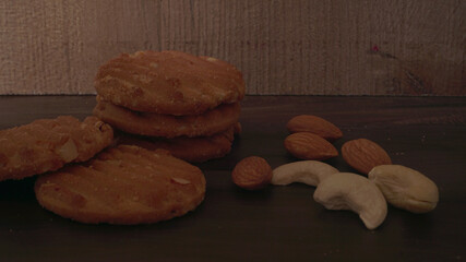Homemade oatmeal cookies with flax and sesame seeds on white wooden table, copy space. Healthy vegan oat cookies